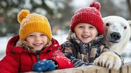 Two children warmly dressed and smiling cheerfully with a polar bear behind them on a snowy day, capturing the joy and wonder of childhood and animal encounters.