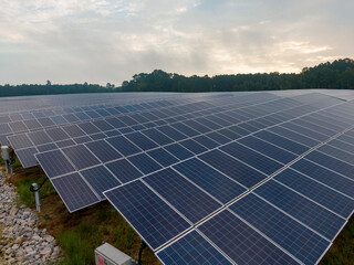 Morning Drone Images of a Large Renewable Solar Farm in Louisburg North Carolina Using Technology and Science for Green Energy & Lowering Carbon Footprints. 