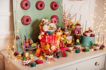 Vibrant party table setup with colorful sweets and decorations, ideal for festive events.