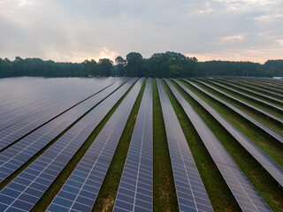 Morning Drone Images of a Large Renewable Solar Farm in Louisburg North Carolina Using Technology and Science for Green Energy & Lowering Carbon Footprints. 