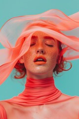 Woman in pink fabric with eyes closed