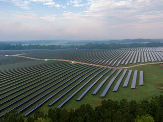 Morning Drone Images of a Large Renewable Solar Farm in Louisburg North Carolina Using Technology and Science for Green Energy & Lowering Carbon Footprints. 