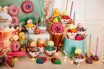 Vibrant party table setup with colorful sweets and decorations, ideal for festive events.