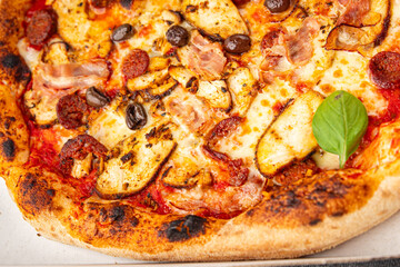 pizza chicken meat, sausages, olives, cheese, tomato sauce.fresh meal food snack on the table copy space food background rustic top view