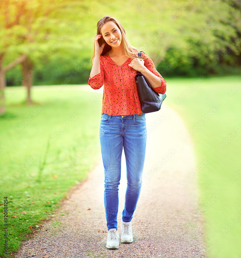 Canvas Prints Woman, walking and portrait on park path, outdoor and eco friendly travel on weekend break in nature. Happiness, smile and holiday in summer for relax, peace and outside for journey with greenery