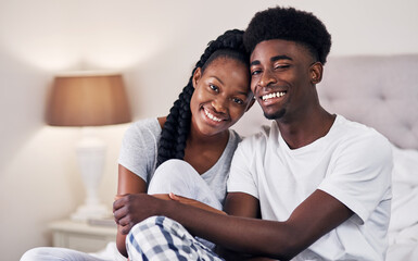 Portrait, black couple and relax with smile in bedroom for love, care and embrace of romance bonding in morning. Happy, man and woman with marriage commitment, trust and relationship support at house