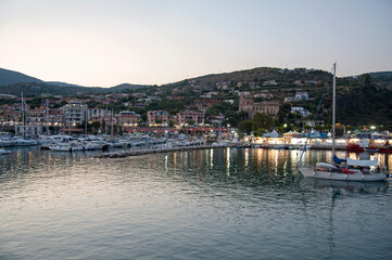 Nightfall over the port in the bay of the seafaring hamlet. Marina di Camerota, Salerno, Italy.