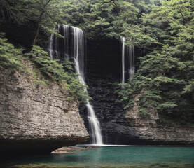 A waterfall is flowing into a pool of water