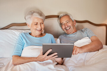 Senior, couple and laughing with tablet in bedroom for social media, browsing internet and watch funny videos. Elderly people, happy and home with technology for comedy movie and entertainment.