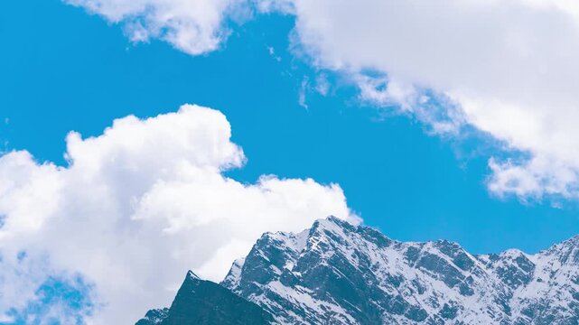 4K Timelapse of mountain landscape with fast moving clouds at Jispa in Himachal Pradesh, India. Travel and Holidays background. Snow mountains and clouds time lapse.