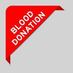 Red color of corner label banner with word blood donation on gray background