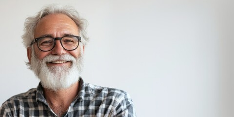 Portrait of a senior smiling man wearing plaid shirt isolated on white background.