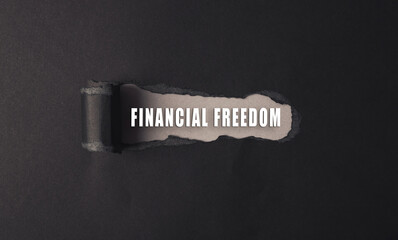 a torn piece of paper with the words financial freedom