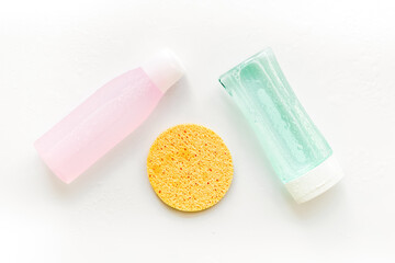 Organic cosmetics for face clearing with sponge, facial tonic and mycelial water on white background top view copy space