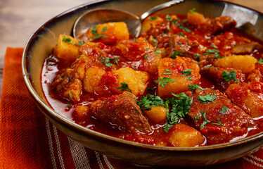Potatoes with meat, stewed in tomato sauce, with spices and herbs, homemade, no people,