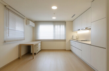 a kitchen with a table a desk and a window with blinds