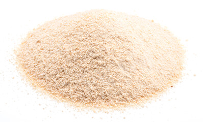 Pile of manioc or cassava flour isolated on white background.