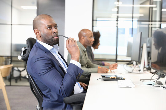 Businessman sitting at desk in office