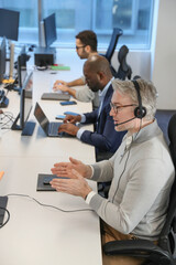 Businessman with headset in office