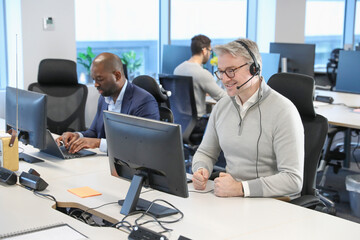 Businessman with headset in office