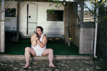 The poor man lives in a trailer park.