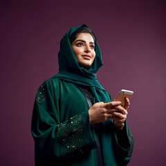 Arab abaya woman happy using mobile phone excited smile. Saudi or Emirati businesswoman.
