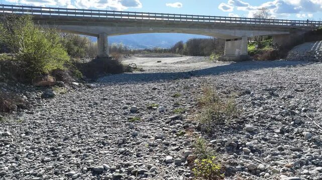 A bridge over the Po River completely dry due to the drought that has been affecting Piedmont for more than a year. Revello, Italy