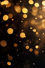 Obraz premium Blurred golden bokeh on black background