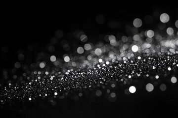 Fototapeta premium Blurred silver bokeh on black background