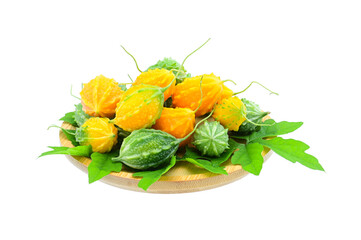 raw and ripe Bitter melon in wood plate on white background,isolated