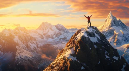 Fotobehang Un alpiniste au sommet d'une montagne enneigée, les bras levés en signe de victoire, surplombant une vue magnifique au lever du soleil. © David Giraud