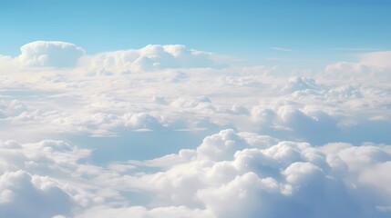 A breathtaking view of fluffy white clouds against a clear blue sky, evoking tranquility.