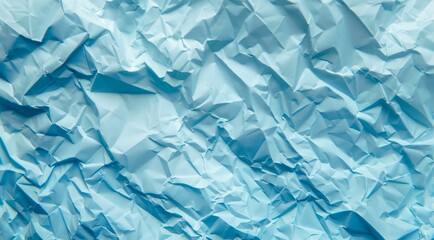 Light blue crumpled paper texture background.