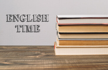 A stack of books with the word English Time written on top