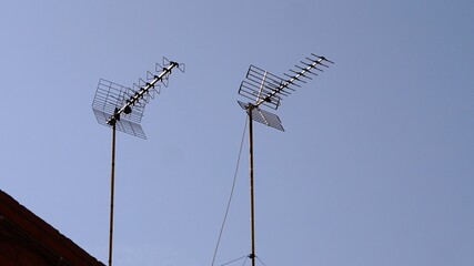 domestic television antennas against the sky