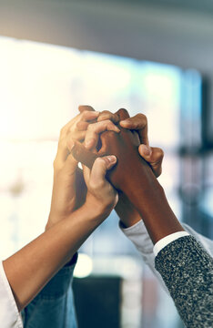 Unity, business people and hands up in office for diversity, inclusion and acceptance for equal opportunity. Trust, employees or motivation with solidarity for group, awareness or support for team