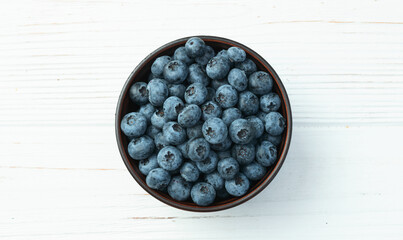 Blueberry photography in a bowl on rustic background