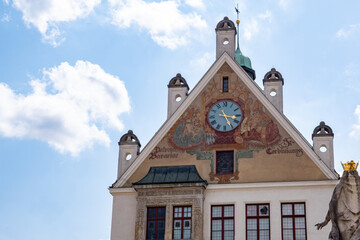 Freising, Bavaria, Germany - August 3, 2024: Town Hall, a historic building (1904) in the middle of the old town. The city coat of arms and a sundial adorn the building