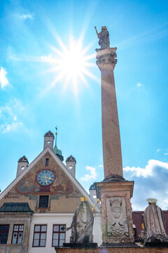 Freising, Bavaria, Germany - August 3, 2024: Marienplatz with Marian Column and Town Hall (built 1904). The Madonna statue is enthroned on a Corinthian marble column at a height of 11 metres