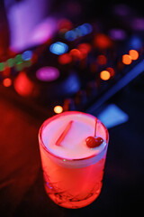 A cocktail in front of the DJ console. Party at the bar.