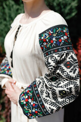 Beautiful national female costume, Ukrainian embroidery on the sleeve.