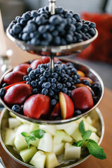 Fruit slices in a beautiful serving, snacks at a celebration