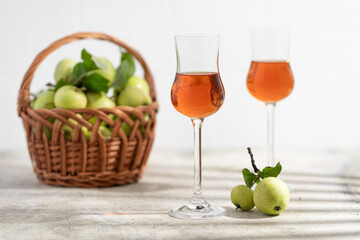apple Calvados in glasses, grappa, green apples, alcoholic drink