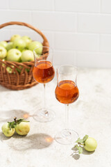 apple Calvados in glasses, grappa, green apples, alcoholic drink