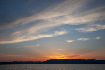 Sunset over a large lake in the mountains