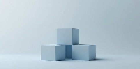 Obraz premium Three Blue Cubes on a Light Blue Background