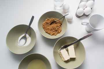 Basic ingredients, kitchen items for baking cakes, cookies or dessert on white background.
