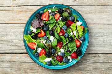 Berries salad (blueberry strawberry blackberry ) with cheese feta and balsamic sauce