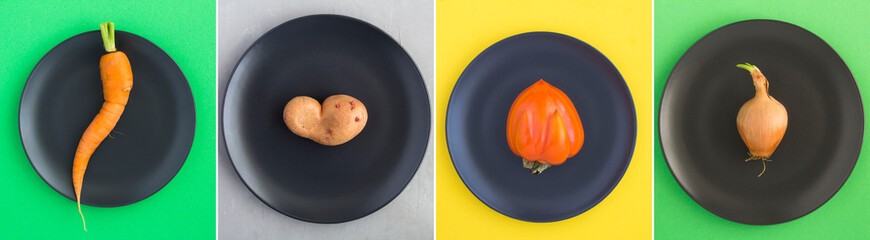 Collage of ugly fruit and vegetable on the black plate on the colored  background. Top view....