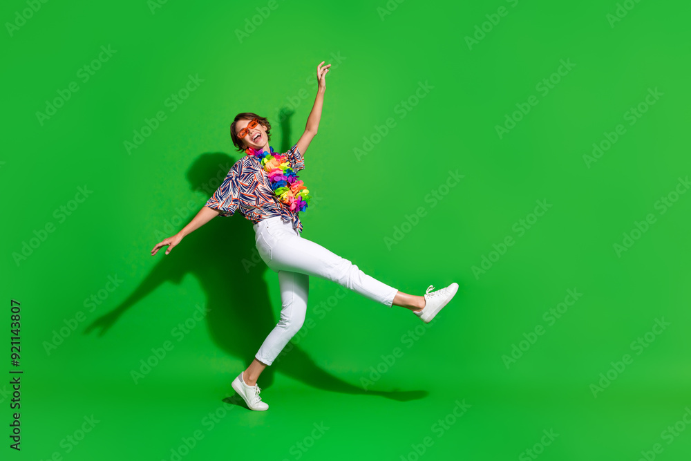 Wall mural full size photo of good mood carefree girl wear print shirt colorful necklace dancing on one leg iso